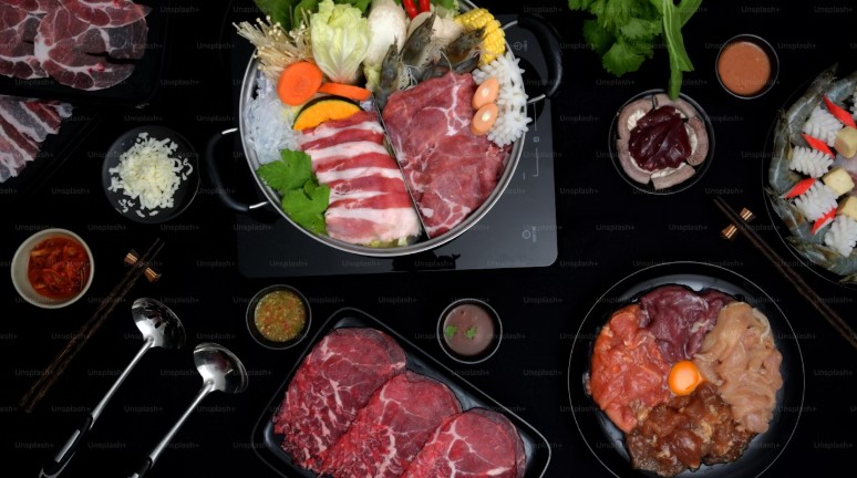 A hearty spread of fresh ingredients for beef sukiyaki