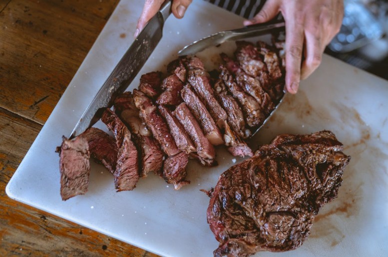 Juicy beef steak freshly sliced, showcasing its tender texture and rich flavor