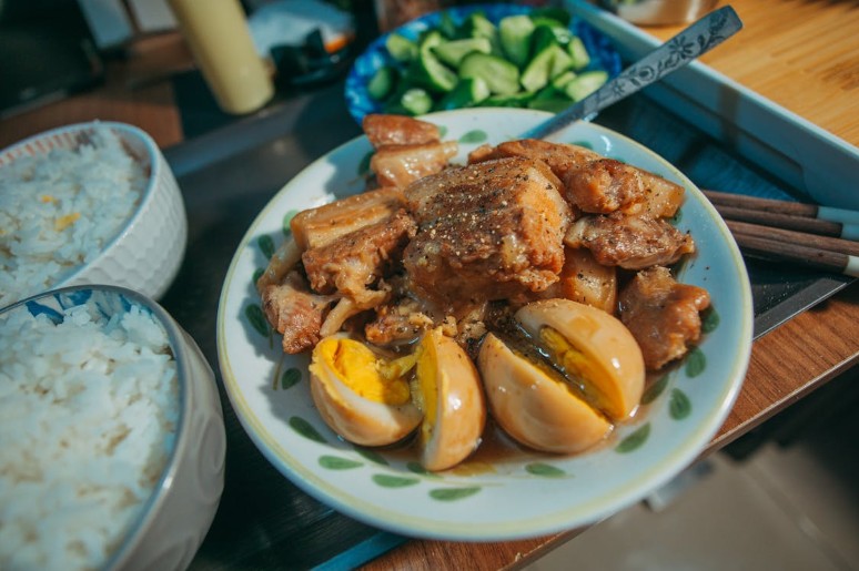 A hearty bowl of pork adobo with rice