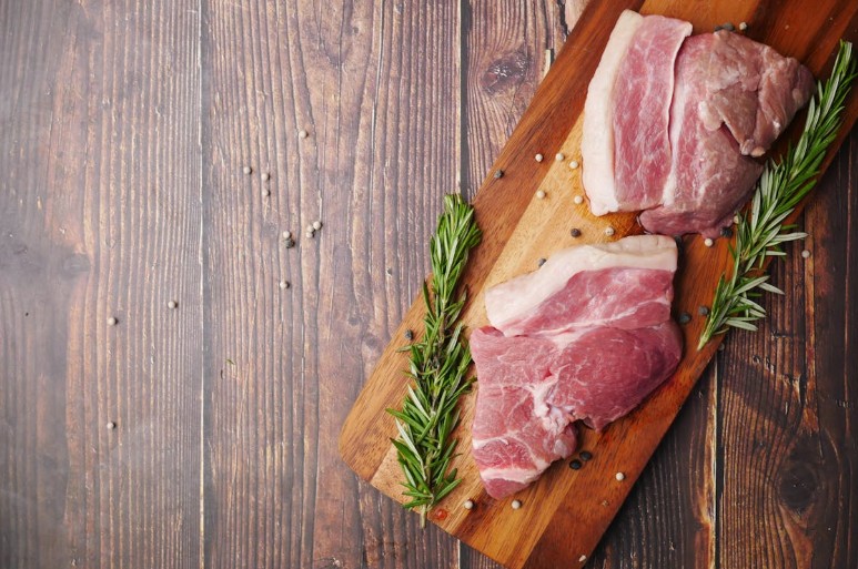 Fresh slices of pork kasim, ready for marinating and cooking into hearty Filipino favorites