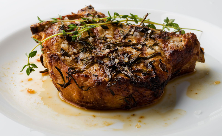 herb-crusted pork chop with thyme